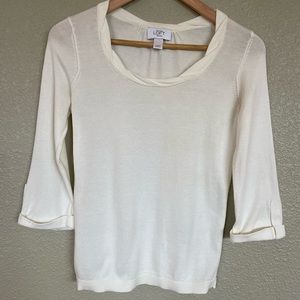 Cream colored 3/4 rolled sleeve lightweight sweater.